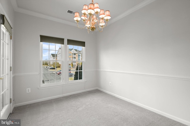 carpeted spare room featuring an inviting chandelier and crown molding