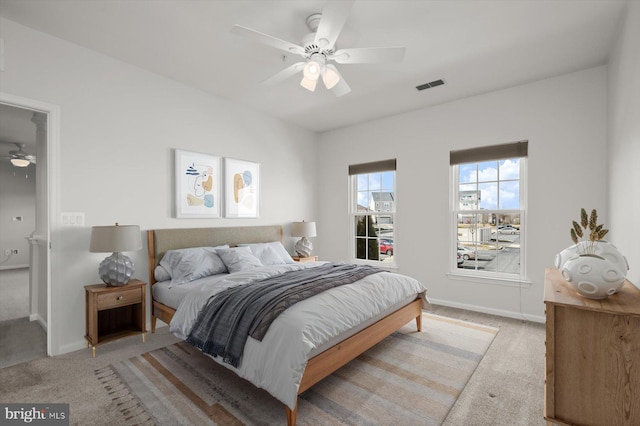 carpeted bedroom with ceiling fan