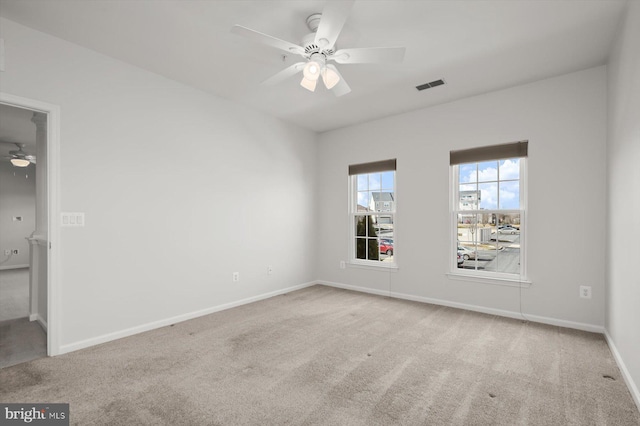 carpeted empty room with ceiling fan