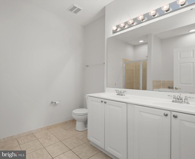 bathroom with vanity, an enclosed shower, tile patterned floors, and toilet