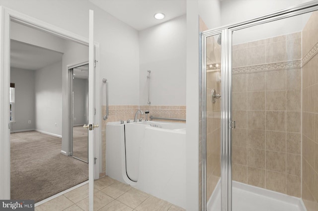 bathroom featuring tile patterned floors and an enclosed shower