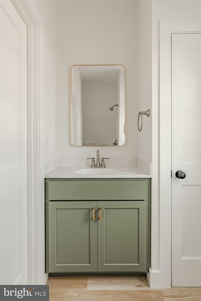 bathroom featuring vanity and hardwood / wood-style floors