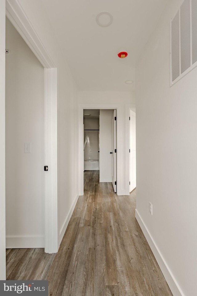 corridor featuring hardwood / wood-style flooring