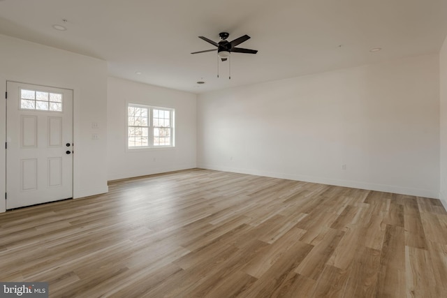 entrance foyer featuring ceiling fan and light wood-type flooring