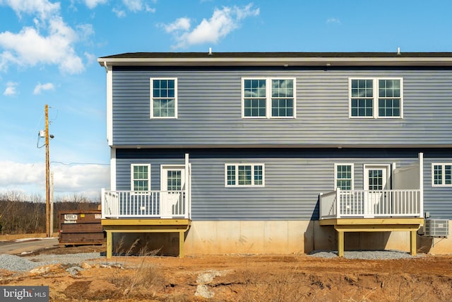 rear view of house with a wooden deck