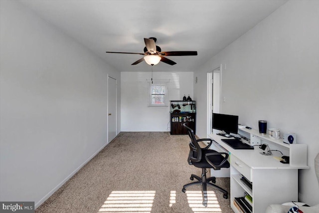 carpeted office with ceiling fan