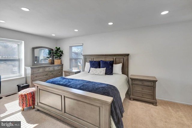 bedroom featuring light colored carpet