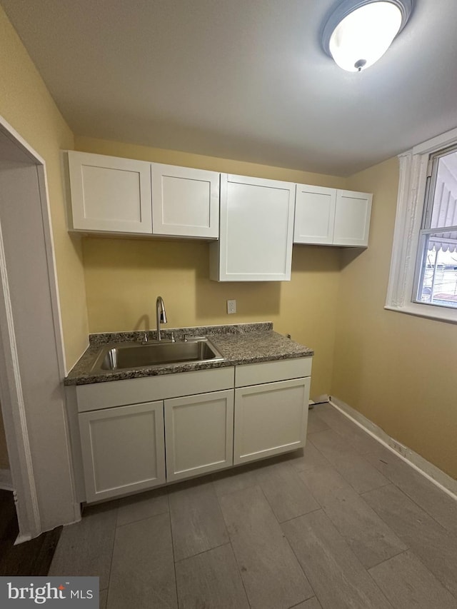 kitchen with sink and white cabinets