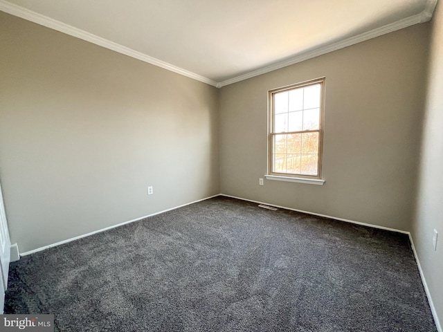 carpeted empty room featuring ornamental molding