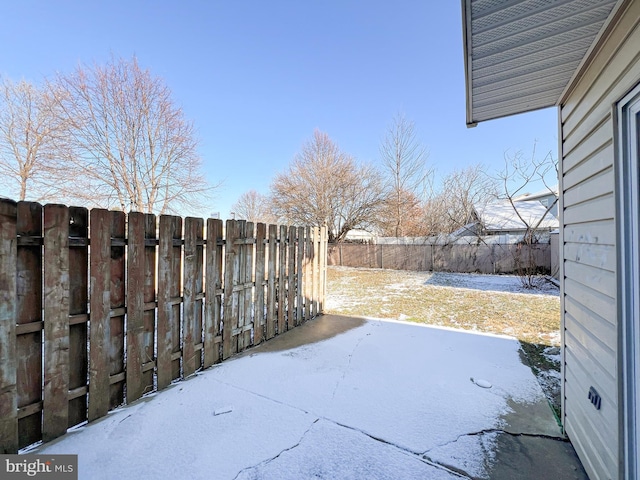 view of yard covered in snow