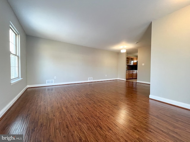 spare room featuring dark hardwood / wood-style floors