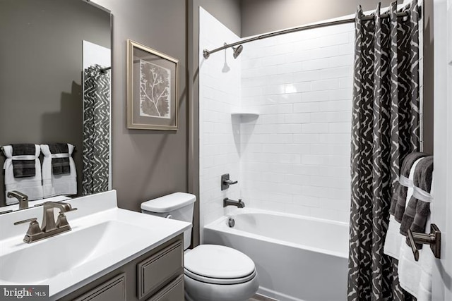 full bathroom featuring vanity, shower / tub combo with curtain, and toilet