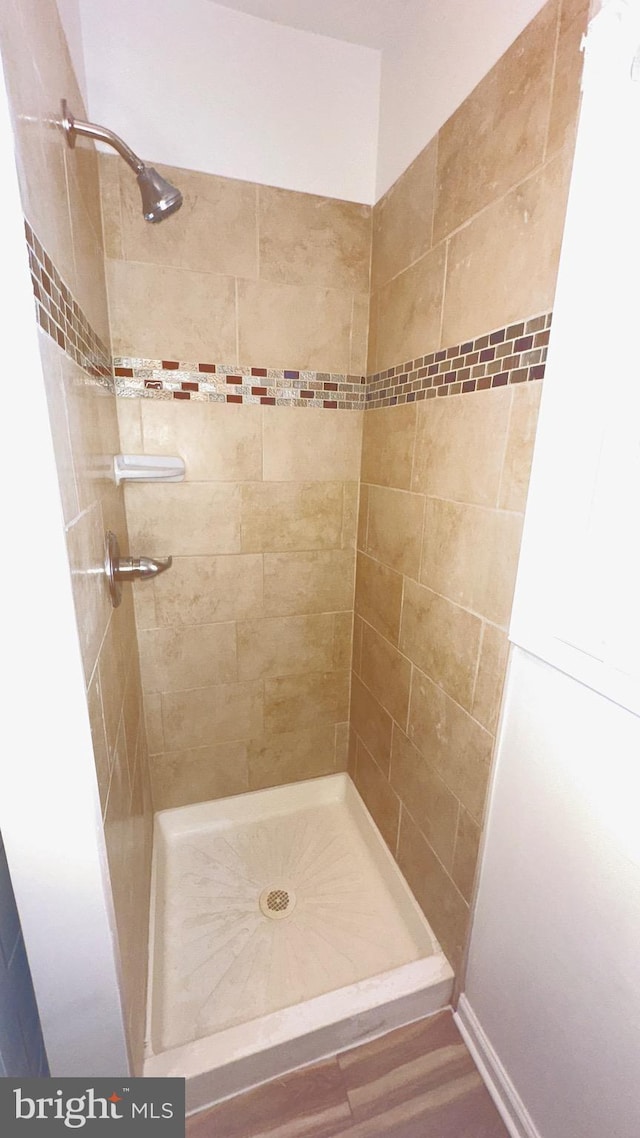 bathroom with tiled shower