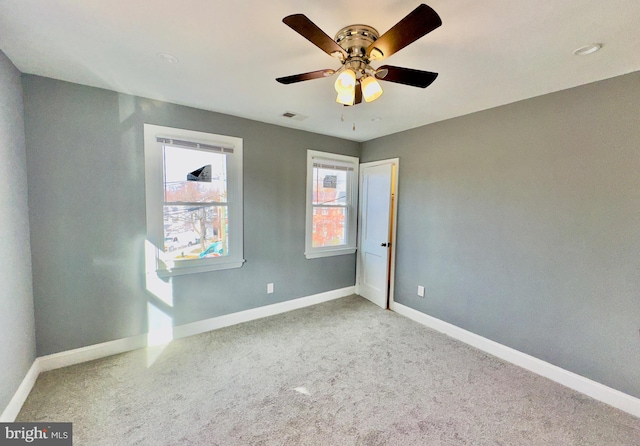 unfurnished bedroom featuring ceiling fan and carpet