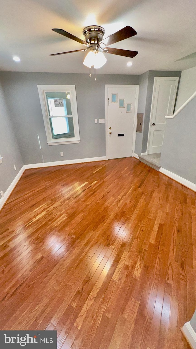 spare room featuring ceiling fan and hardwood / wood-style floors