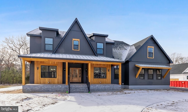 modern farmhouse featuring covered porch