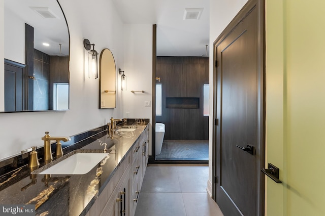 bathroom with vanity and a shower