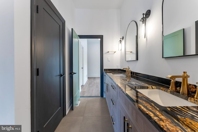 bathroom with tile patterned floors and vanity