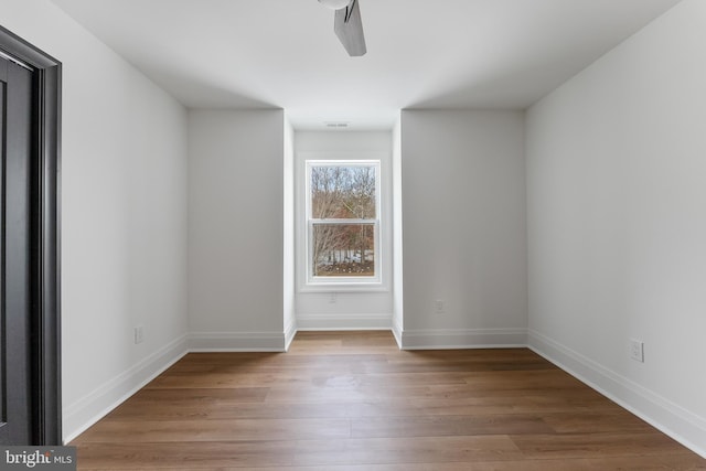 unfurnished room with light hardwood / wood-style flooring