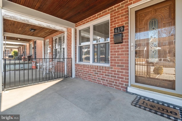 doorway to property featuring a porch