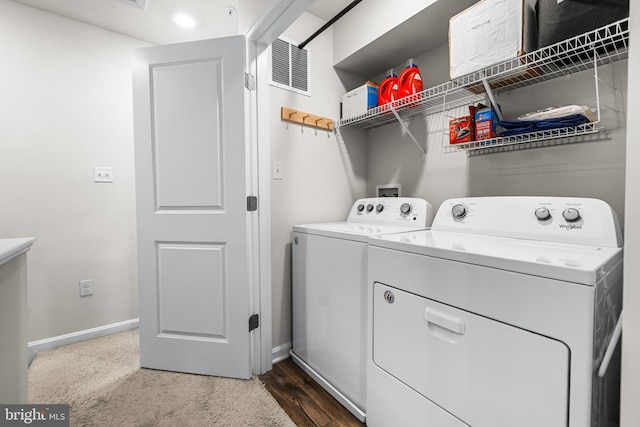 laundry area with independent washer and dryer