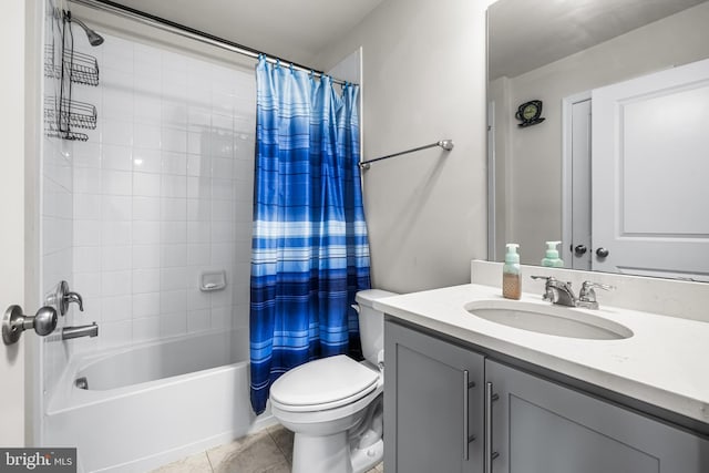 full bathroom with shower / tub combo, vanity, tile patterned floors, and toilet