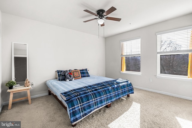 bedroom with ceiling fan and carpet flooring