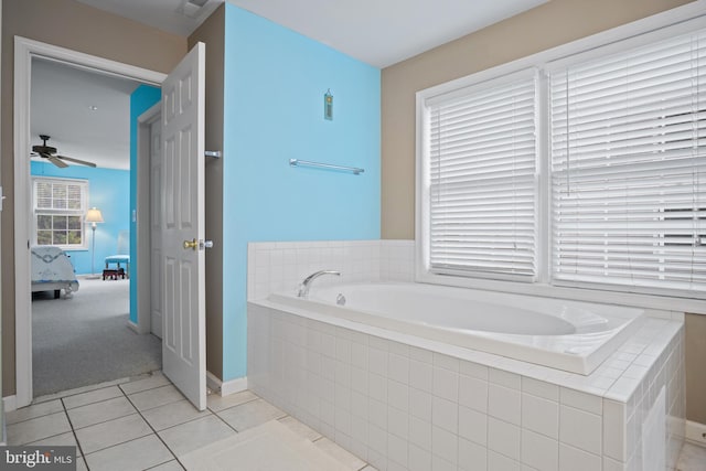 bathroom with tile patterned flooring and a relaxing tiled tub