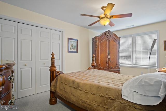 carpeted bedroom featuring a closet and ceiling fan