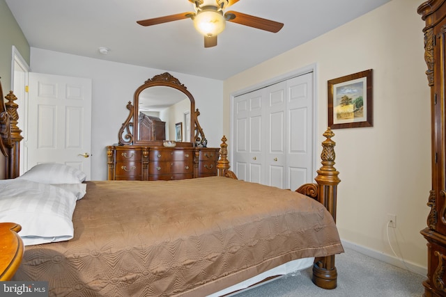 carpeted bedroom with ceiling fan and a closet