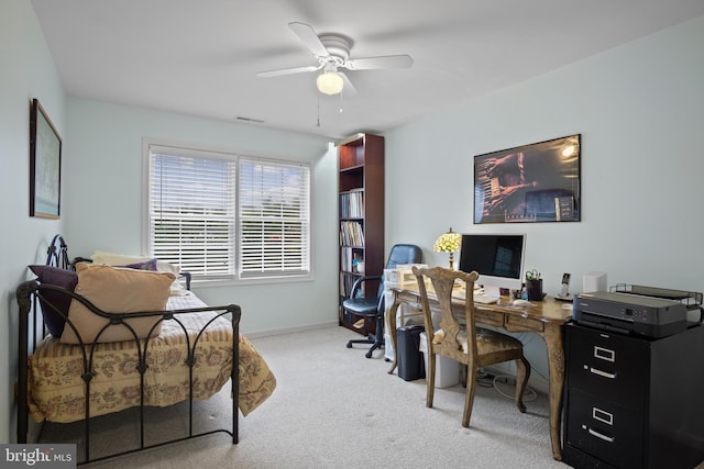 home office featuring light colored carpet and ceiling fan