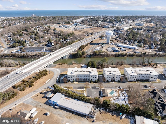 birds eye view of property featuring a water view