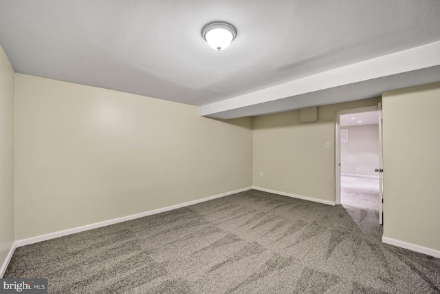 finished below grade area featuring carpet floors and baseboards