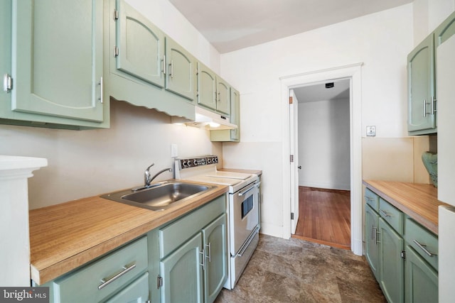 kitchen featuring sink, green cabinets, and electric stove