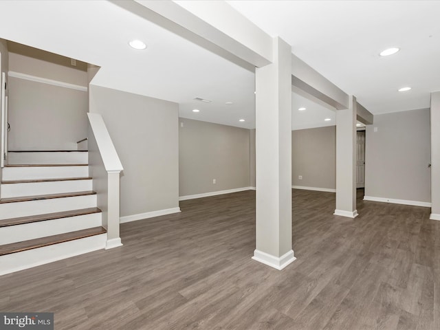 basement featuring dark hardwood / wood-style floors