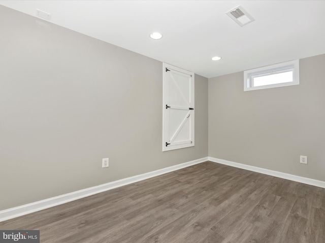 spare room featuring dark hardwood / wood-style floors