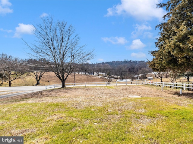 view of yard with a rural view