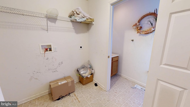 laundry area featuring hookup for a washing machine, visible vents, hookup for an electric dryer, laundry area, and baseboards