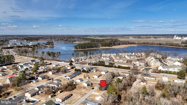 drone / aerial view with a water view and a residential view