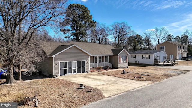 single story home featuring a garage and concrete driveway