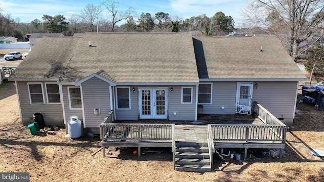 back of house with a shingled roof, french doors, and a deck