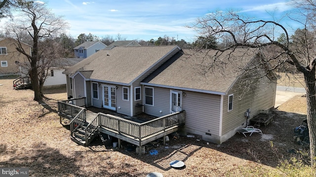 rear view of house featuring a shingled roof, crawl space, a wooden deck, and french doors