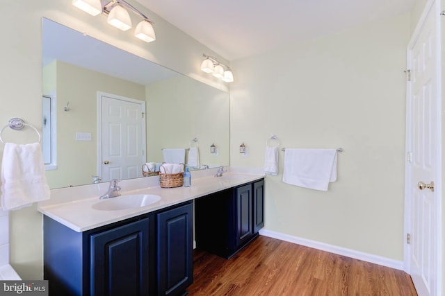 bathroom featuring vanity and hardwood / wood-style flooring