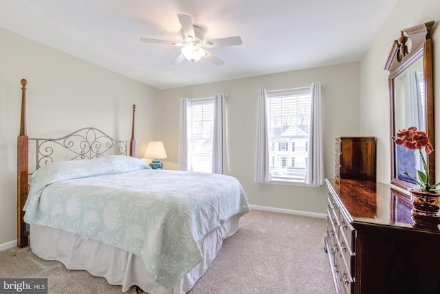 bedroom with light carpet and ceiling fan