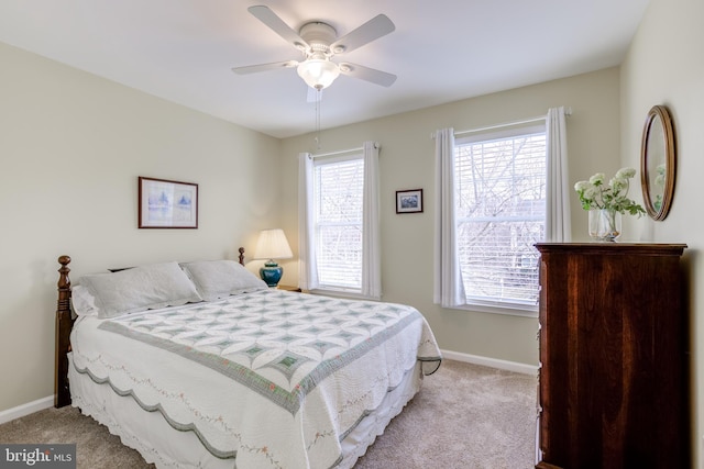 bedroom featuring light colored carpet and ceiling fan