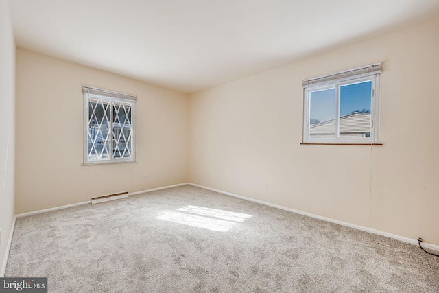 unfurnished room with light carpet