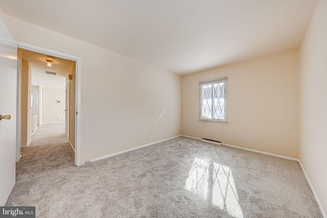 unfurnished room with light colored carpet