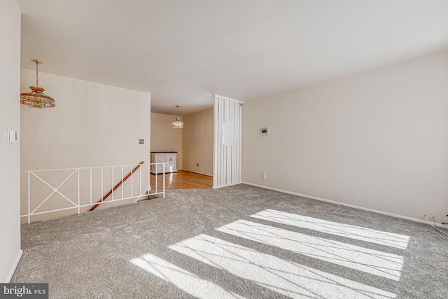 empty room featuring light carpet