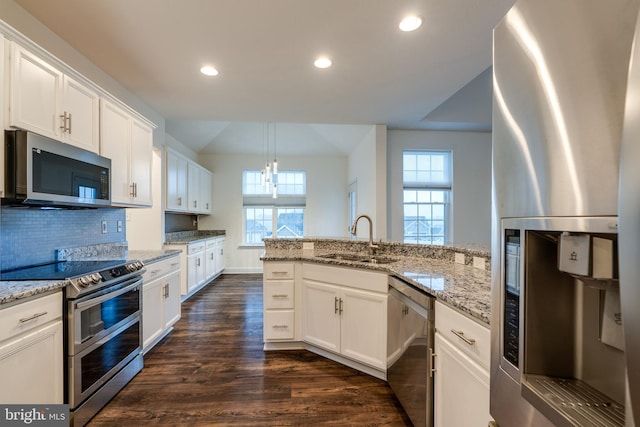 kitchen featuring white cabinetry, sink, and appliances with stainless steel finishes