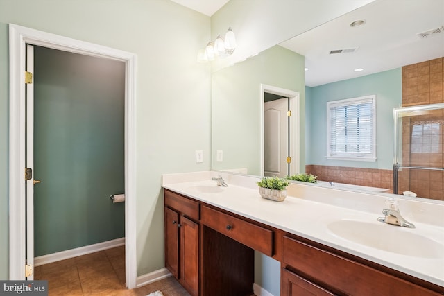 bathroom featuring vanity, tile patterned flooring, and independent shower and bath